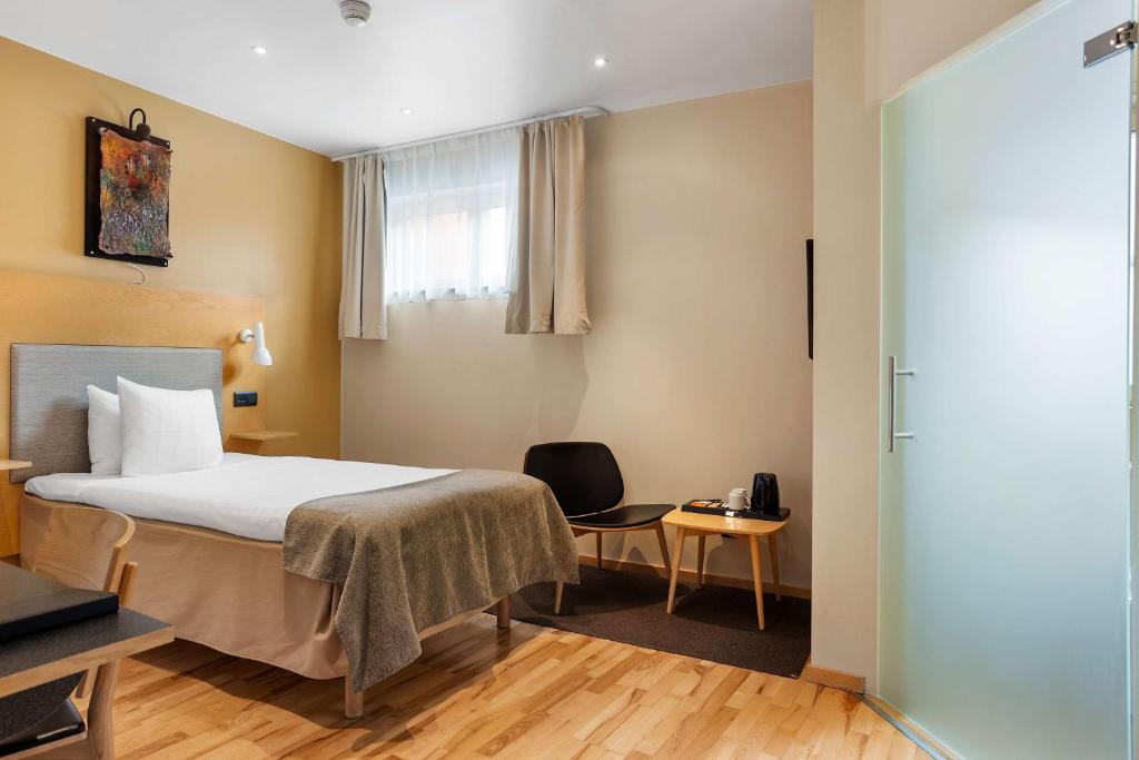 Postel nebo postele na pokoji v ubytování Best Western Hotel Royal