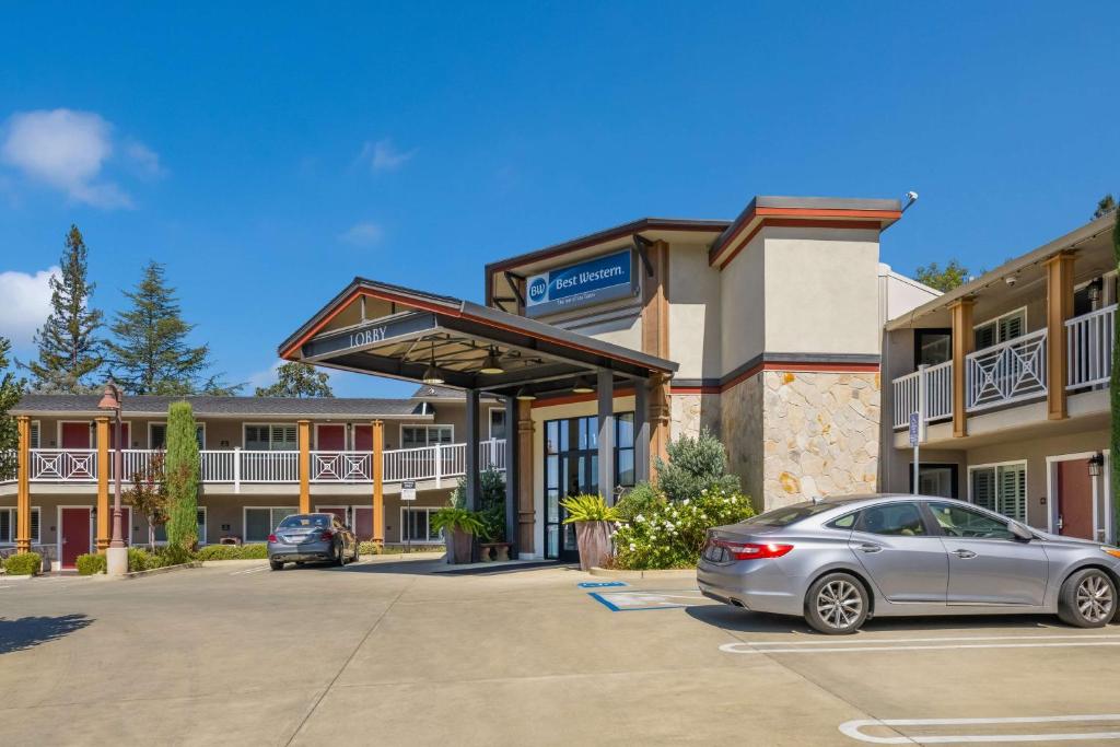 a car parked in a parking lot in front of a hotel at BEST WESTERN the Inn of Los Gatos in Los Gatos