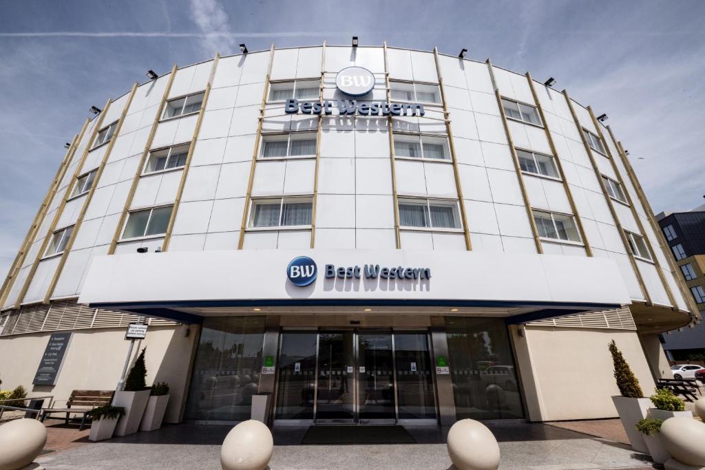 a building with a sign on the front of it at Best Western London Heathrow Ariel Hotel in Hillingdon