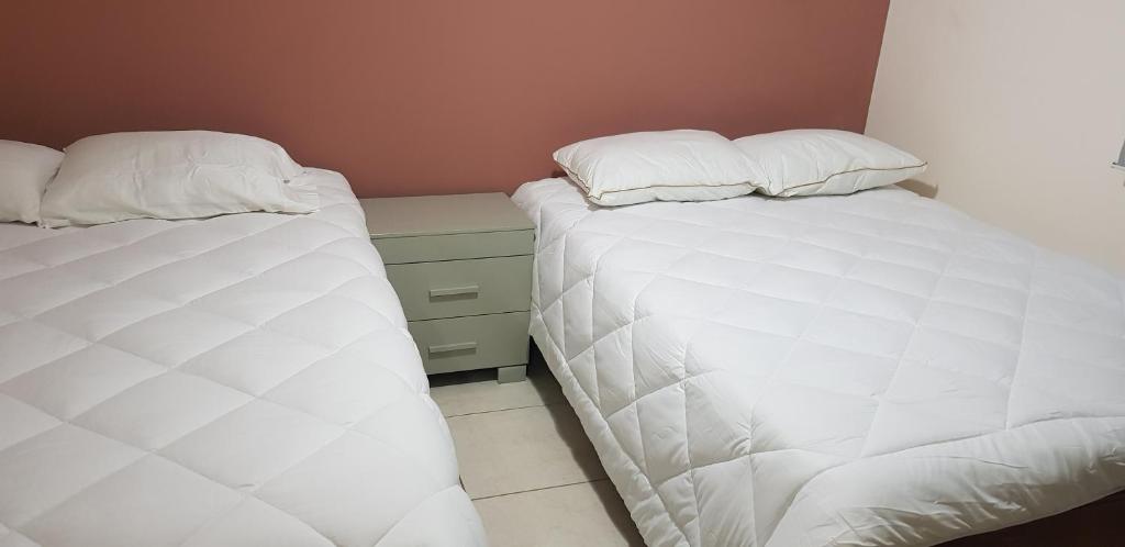 מיטה או מיטות בחדר ב-Hospedaje vacacional