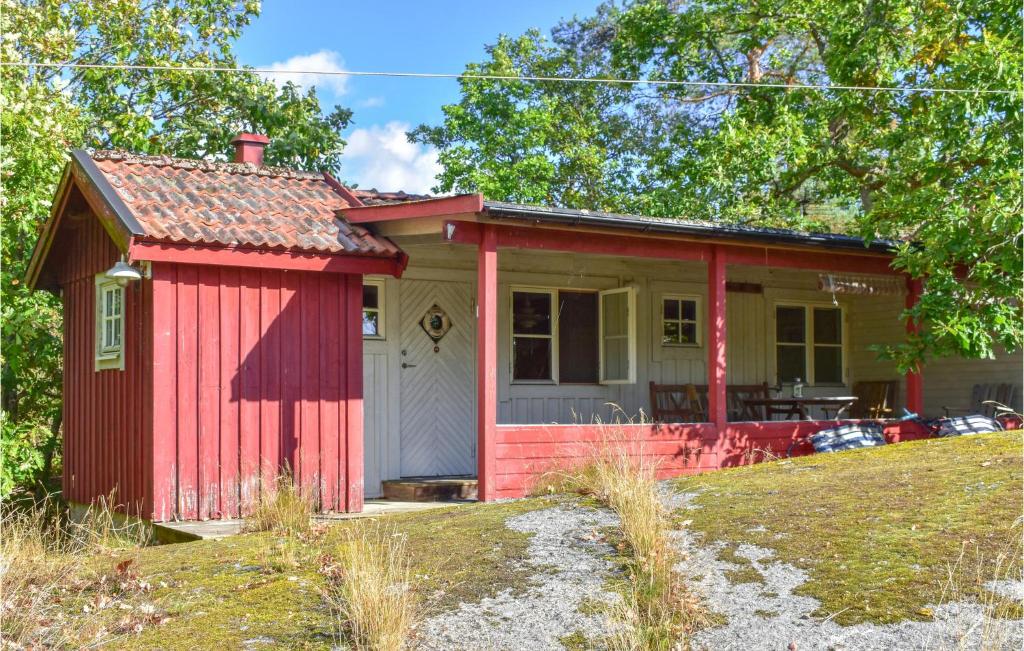 a red and white house with a yard at Awesome Home In Ronneby With Wifi in Ronneby