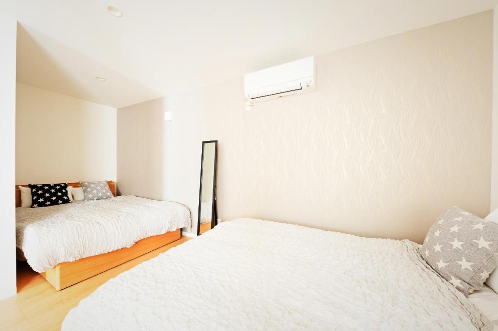 Postel nebo postele na pokoji v ubytování APHONGO HOTEL