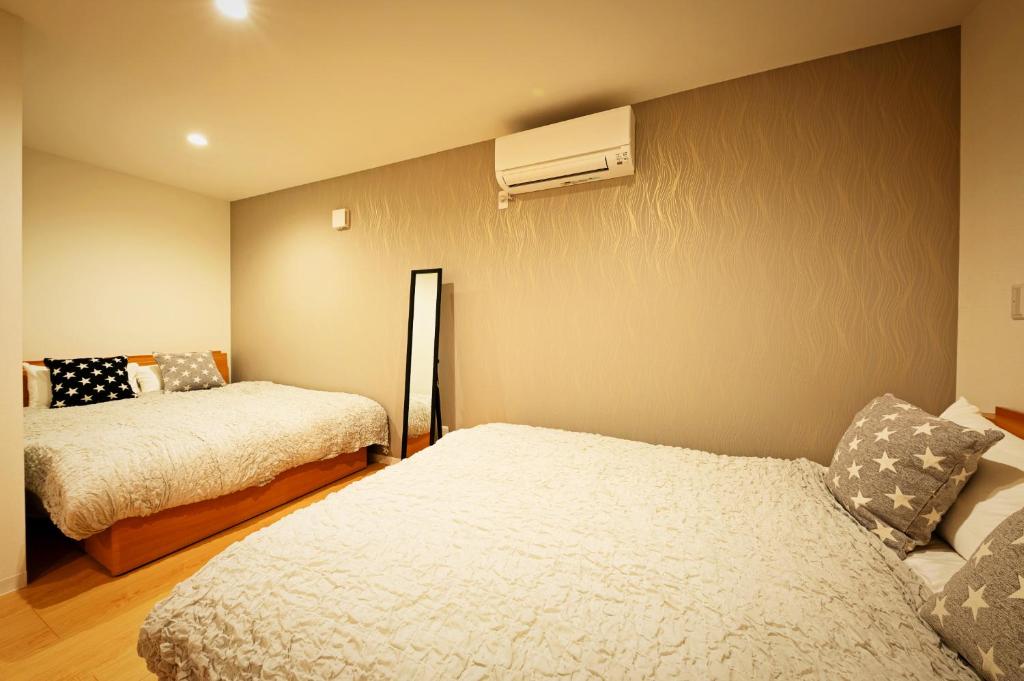 Postel nebo postele na pokoji v ubytování APHONGO HOTEL