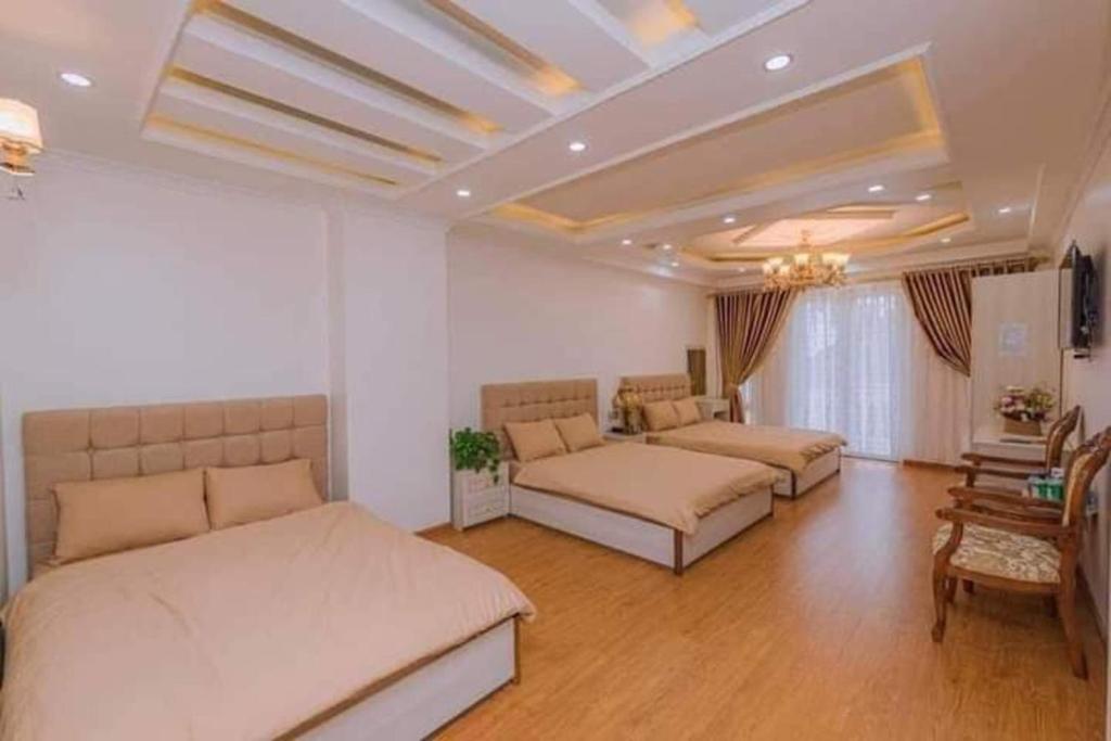 Postel nebo postele na pokoji v ubytování Thanh Anh Hotel Da Lat