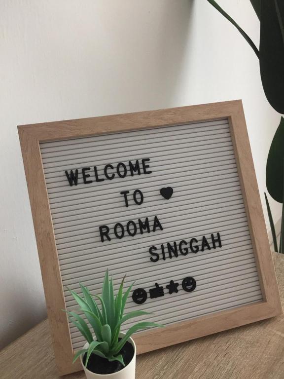 um sinal que diz bem-vindo a Roma Singan em Rooma Singgah Homestay @ Cherating em Kuantan