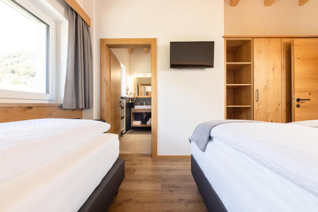 Postel nebo postele na pokoji v ubytování Apartments am Bichl