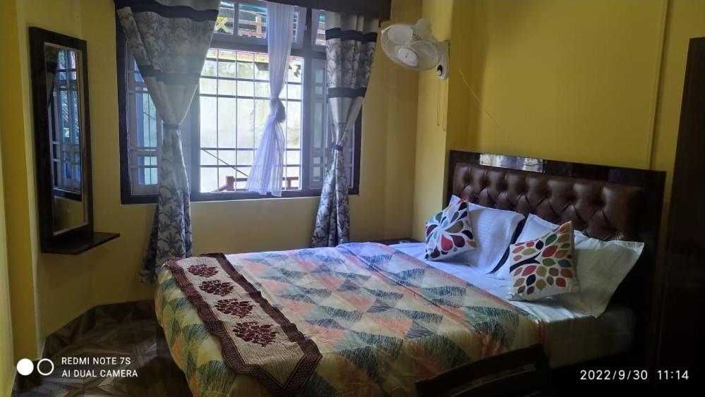 Katil atau katil-katil dalam bilik di Hotel Parichit