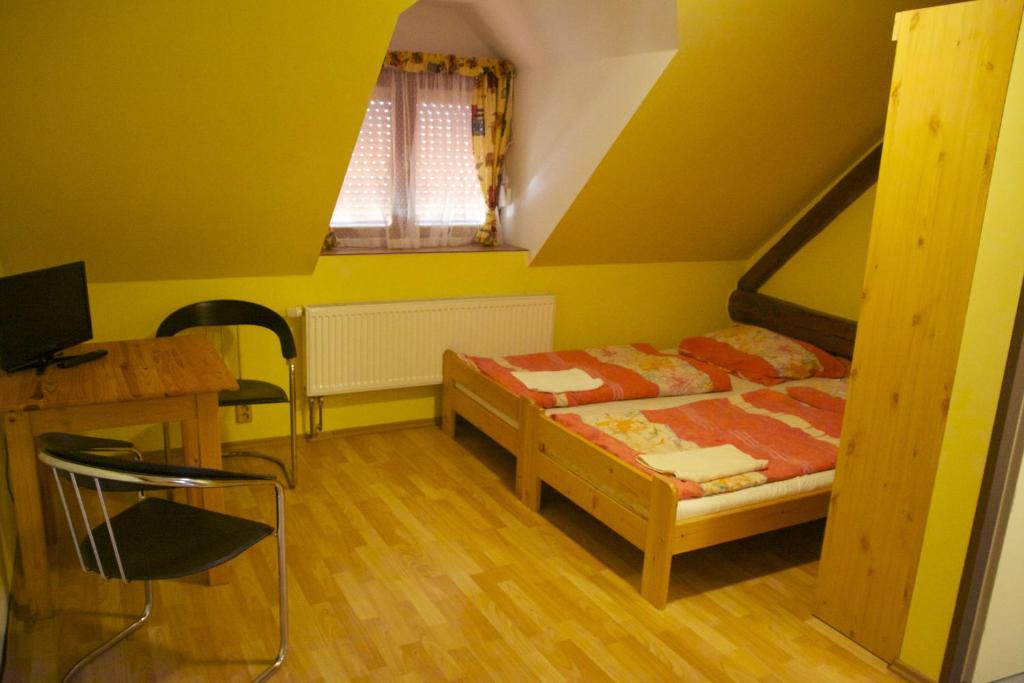 Postel nebo postele na pokoji v ubytování Penzion Ambrozie