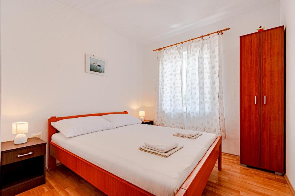 Postel nebo postele na pokoji v ubytování Siriščević Apartment
