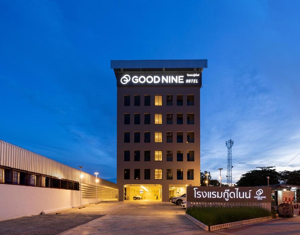 a building with a sign on the side of it at Good nine Hotel in Bang Bo