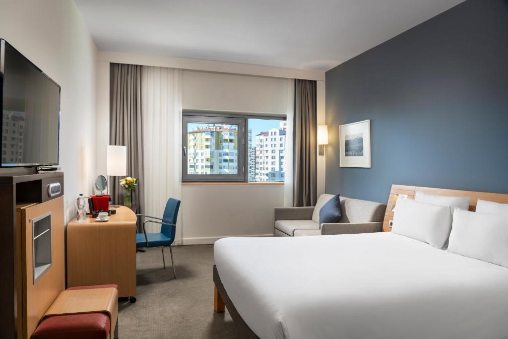 Cama ou camas em um quarto em Novotel Kayseri