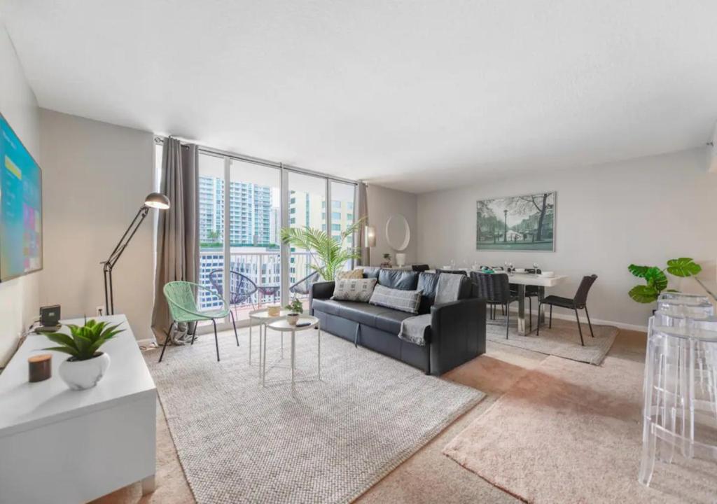 a living room with a couch and a table at Attractive 2/2 Condo In Brickell With Pool in Miami