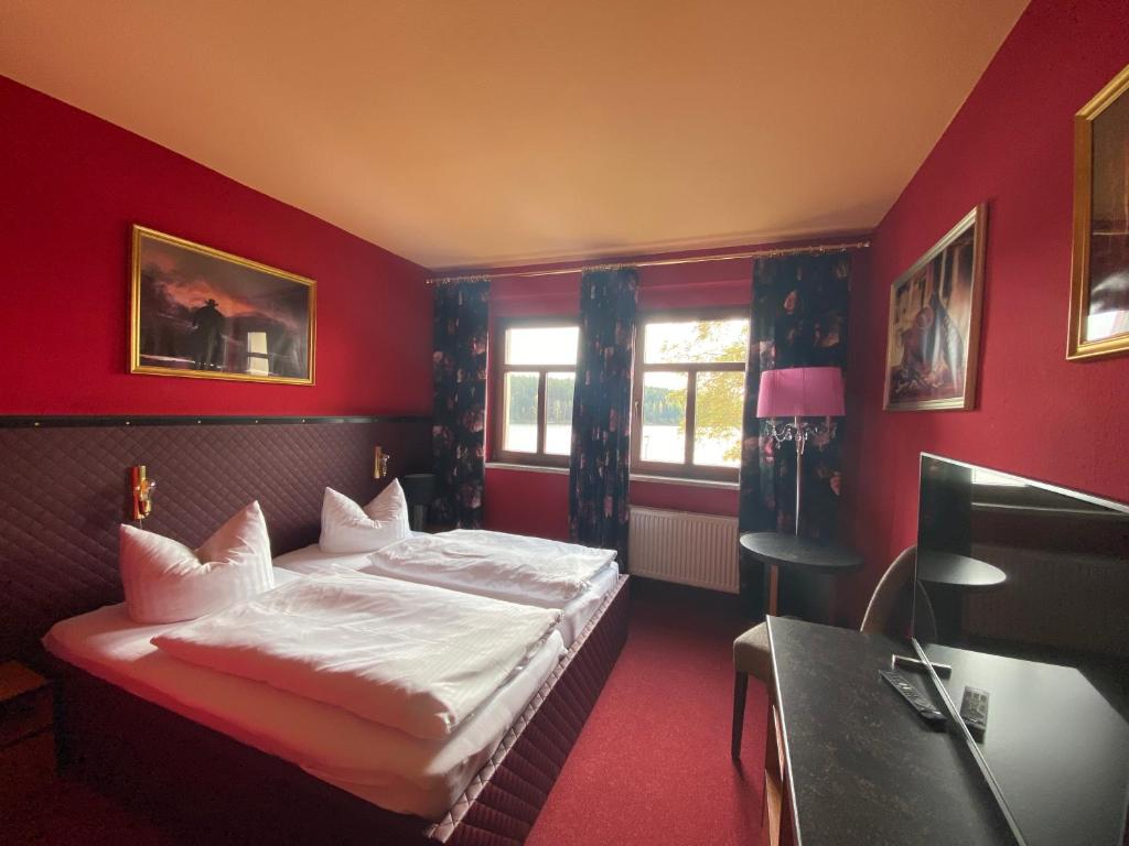 Voodi või voodid majutusasutuse Riverdam Boutique Hotel toas