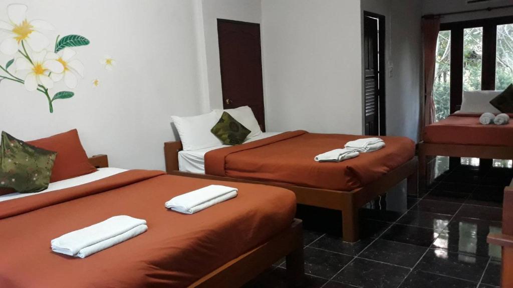 Postel nebo postele na pokoji v ubytování LUCKY PAI Resort&Hostel