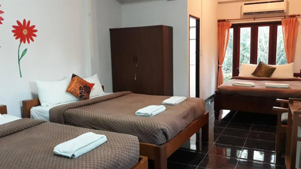 Postel nebo postele na pokoji v ubytování LUCKY PAI Resort&Hostel