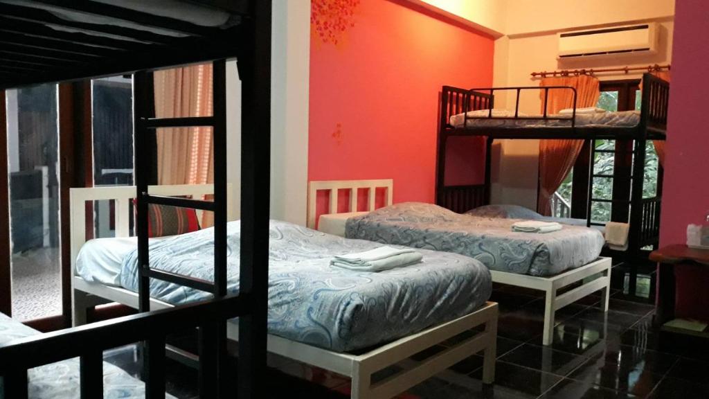 Postel nebo postele na pokoji v ubytování LUCKY PAI Resort&Hostel