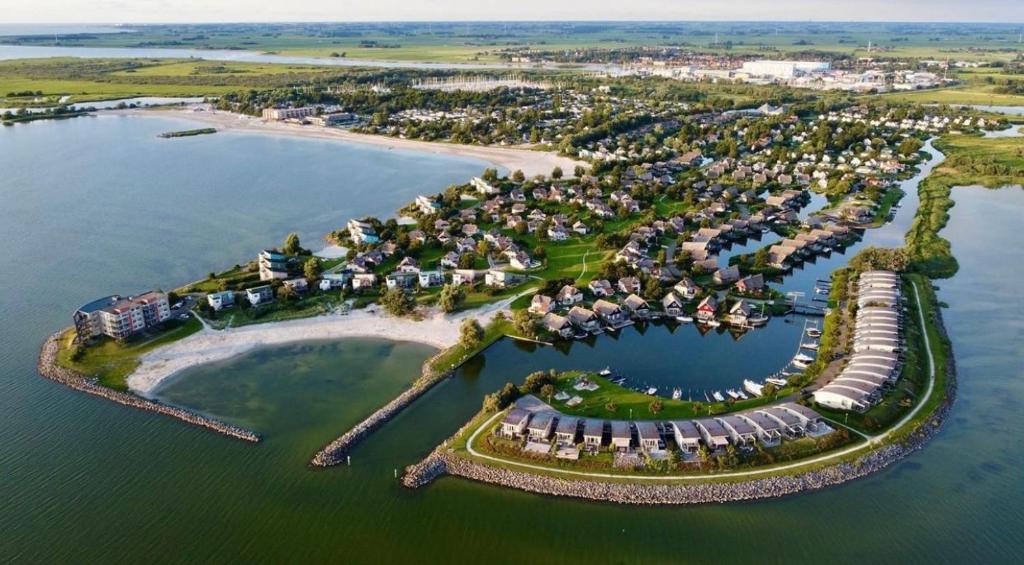 an aerial view of a resort island in the water at Beach Resort Makkum in Makkum