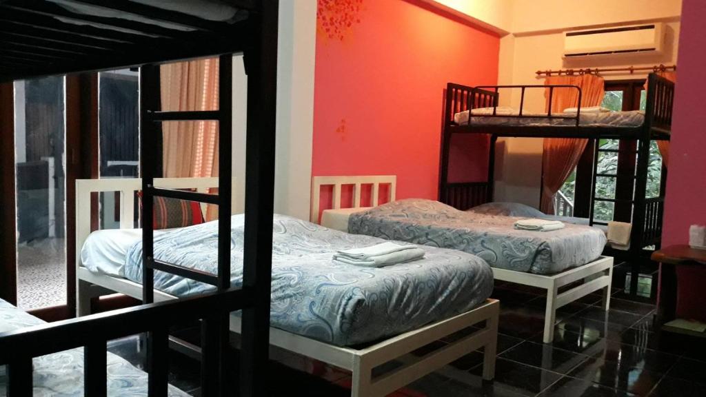 Postel nebo postele na pokoji v ubytování LUCKY PAI Resort&Hostel