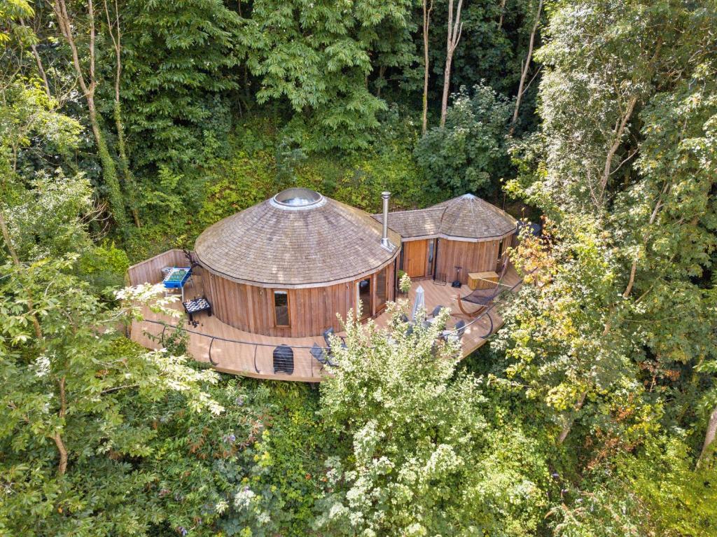 an aerial view of a large house in the forest at Finest Retreats - Buzzard Luxury Treehouse Hideaway in Dittisham