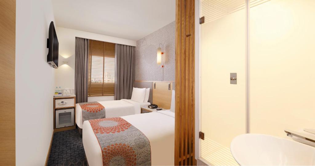 Postel nebo postele na pokoji v ubytování Holiday Inn Express Chennai OMR Thoraipakkam by IHG