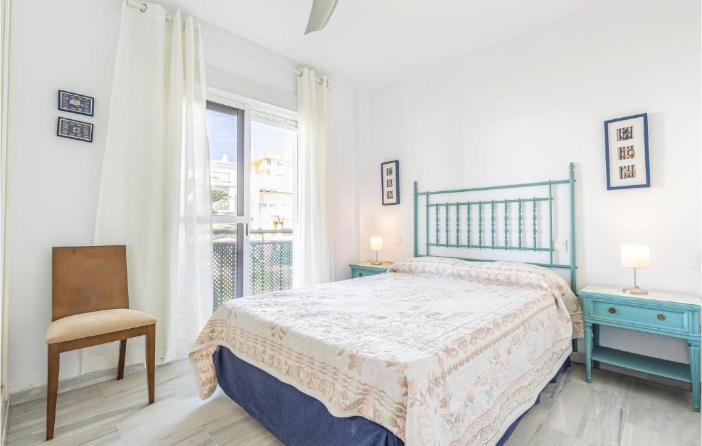 A bed or beds in a room at 2 Bedroom Nice Apartment In Torrox