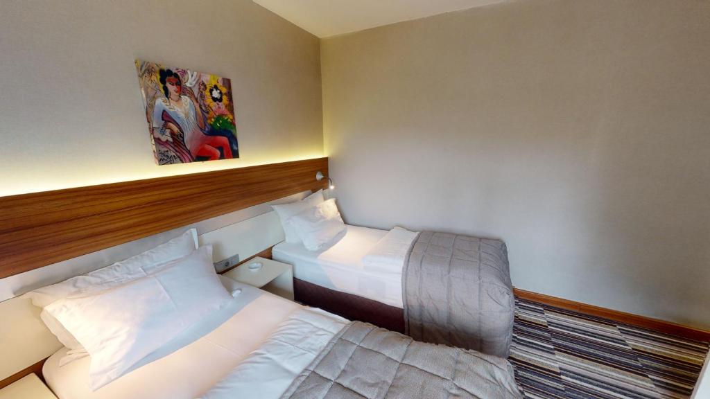 Postel nebo postele na pokoji v ubytování Mimi Hotel Ankara