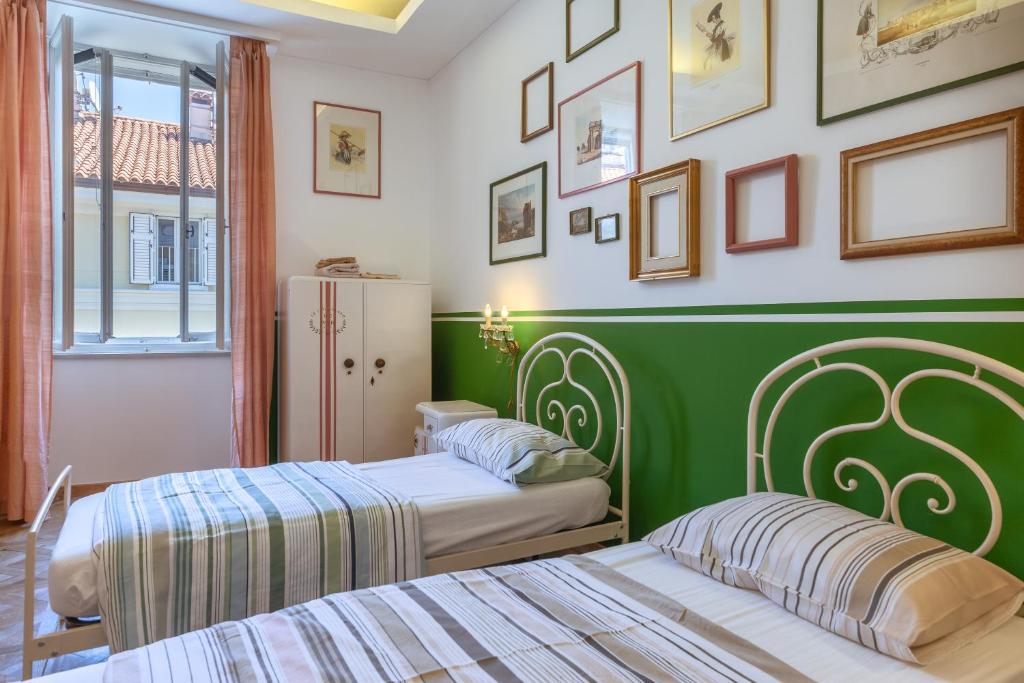 A bed or beds in a room at Le Dimore del Teatro