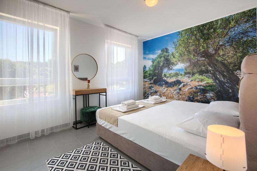 Posteľ alebo postele v izbe v ubytovaní Beautiful Two-Bedroom Seaside Apartment in Premantura