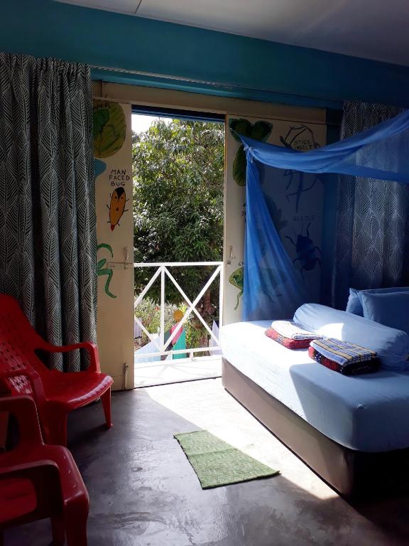 Postel nebo postele na pokoji v ubytování Tahan Guest House