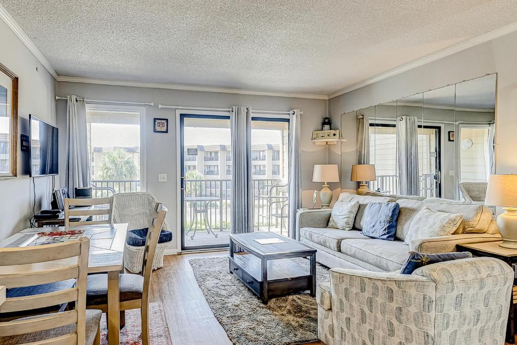 a living room with a couch and a table at HH Beach & Tennis 246B in Hilton Head Island