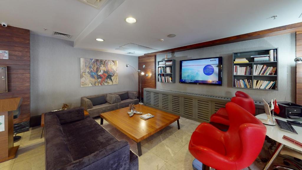 TV a/nebo společenská místnost v ubytování Mimi Hotel Ankara