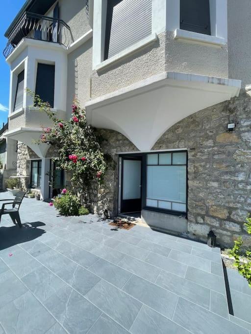 a building with a bench in front of it at Au coeur des Alpes 3 in La Roche-sur-Foron