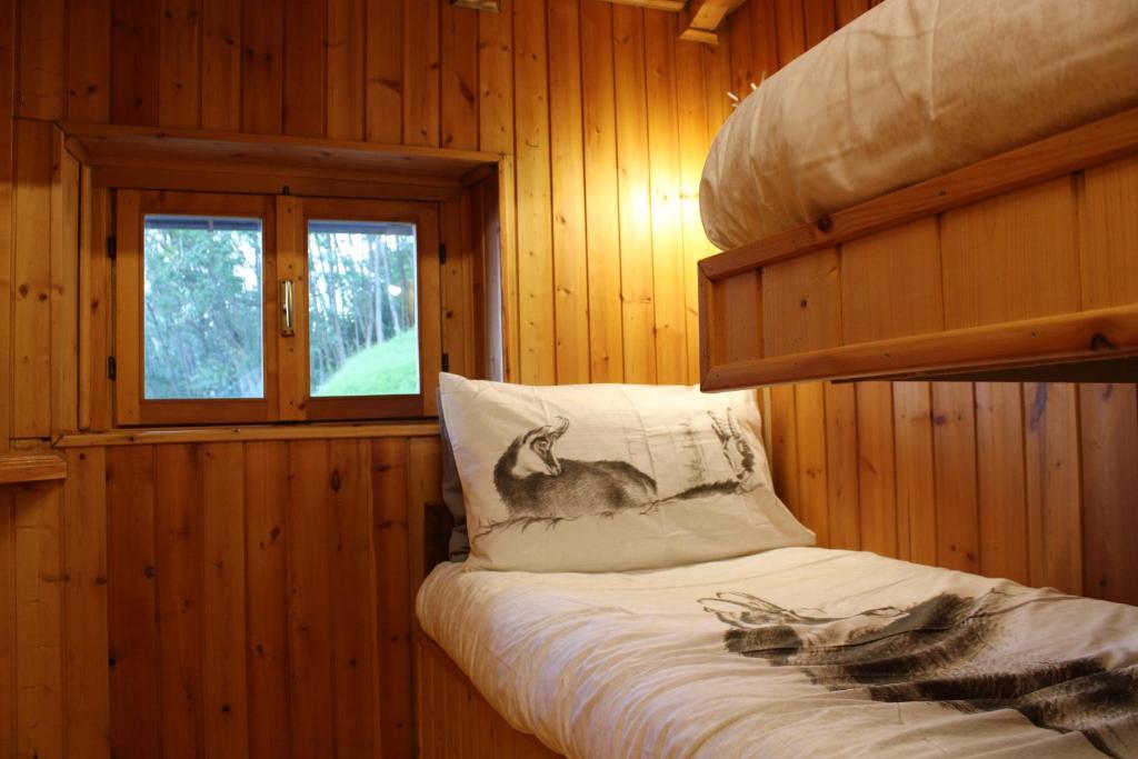 Łóżko lub łóżka w pokoju w obiekcie Sweet Somma Mountain Lodge 2