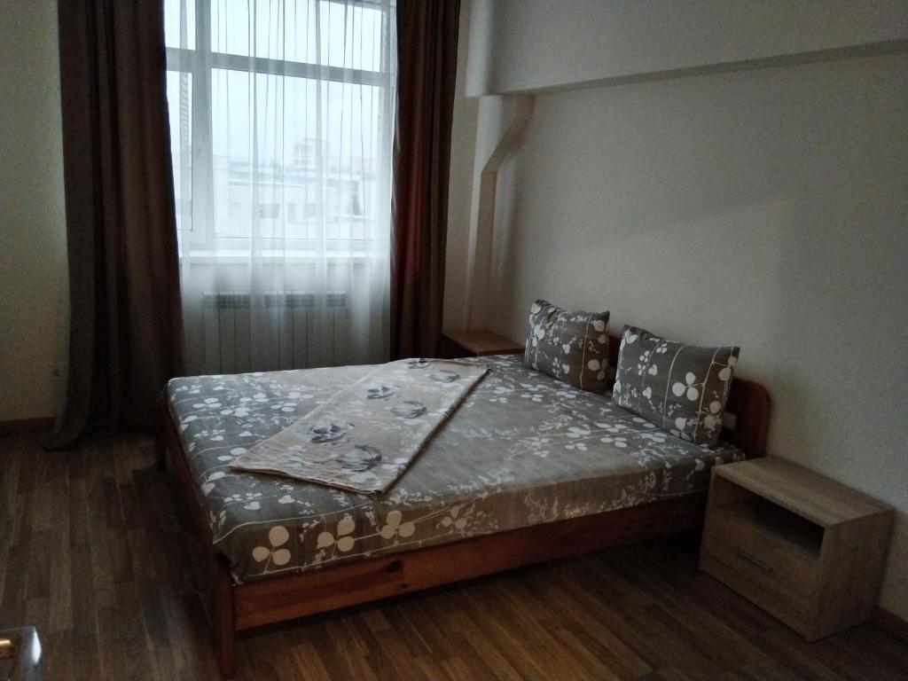 Ένα ή περισσότερα κρεβάτια σε δωμάτιο στο Kiev Smart Home
