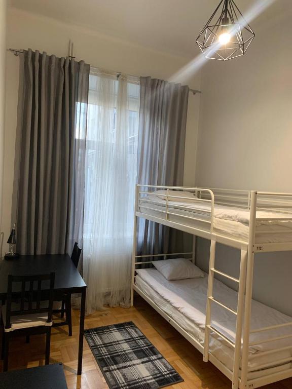 Posteľ alebo postele v izbe v ubytovaní Cent Hostel
