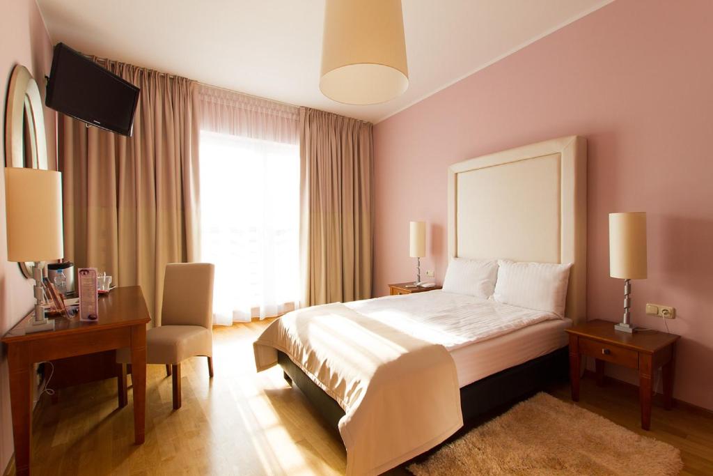 Ein Bett oder Betten in einem Zimmer der Unterkunft Don Prestige Residence