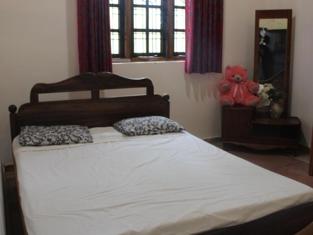 Postel nebo postele na pokoji v ubytování Holiday Home Anuradapura