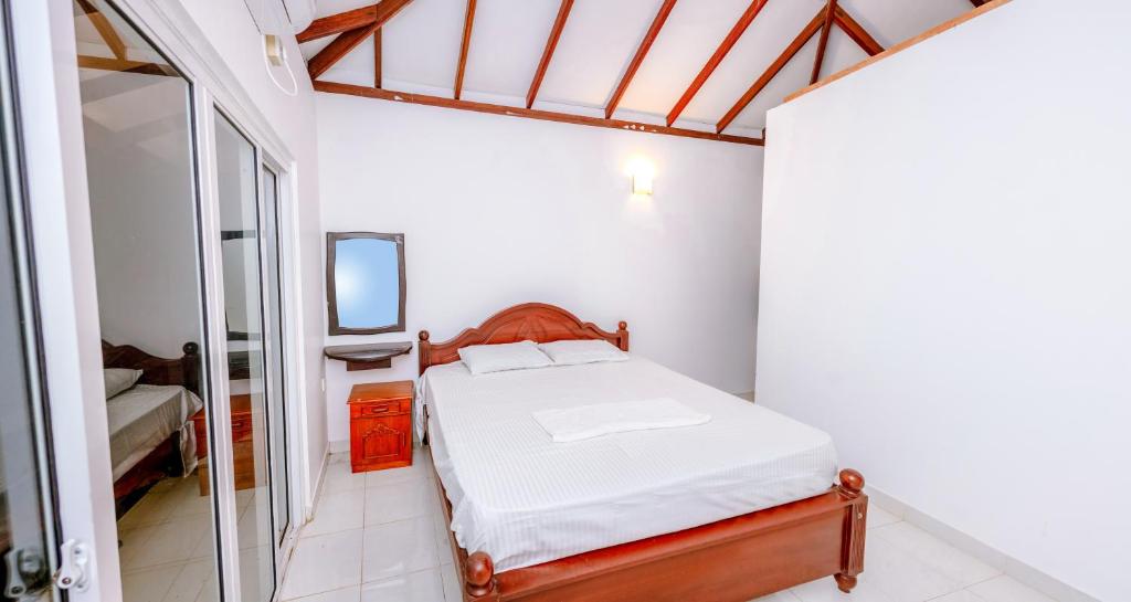 Postel nebo postele na pokoji v ubytování Savenndra Resorts