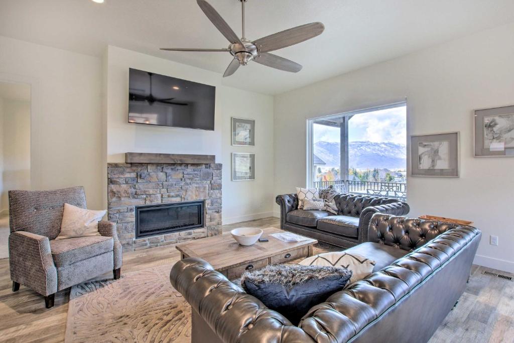 a living room with a couch and a fireplace at Scenic Eden Gem with Hot Tub about 6 Mi to Ski Area in Eden