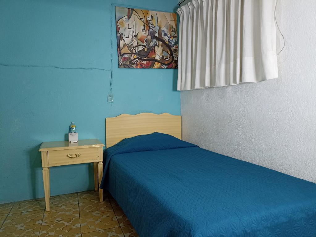 Postel nebo postele na pokoji v ubytování Hotel Viena