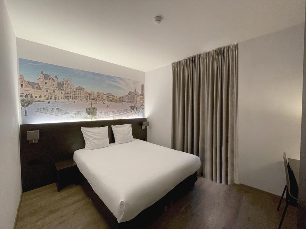 Postel nebo postele na pokoji v ubytování 3 Paardekens - City Centre Hotel