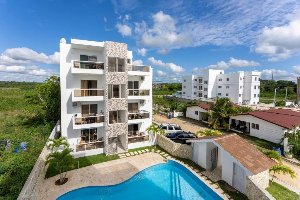 an aerial view of a apartment complex with a swimming pool at Larimar 302 - Bayahibe in Bayahibe