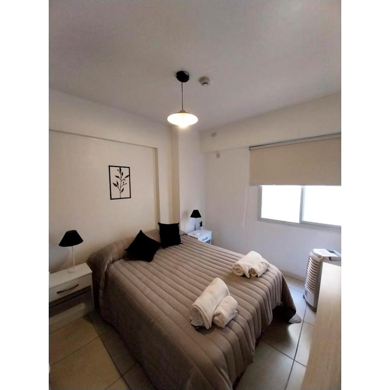 Кровать или кровати в номере Shanti Alojamiento Monoambiente y Departamento