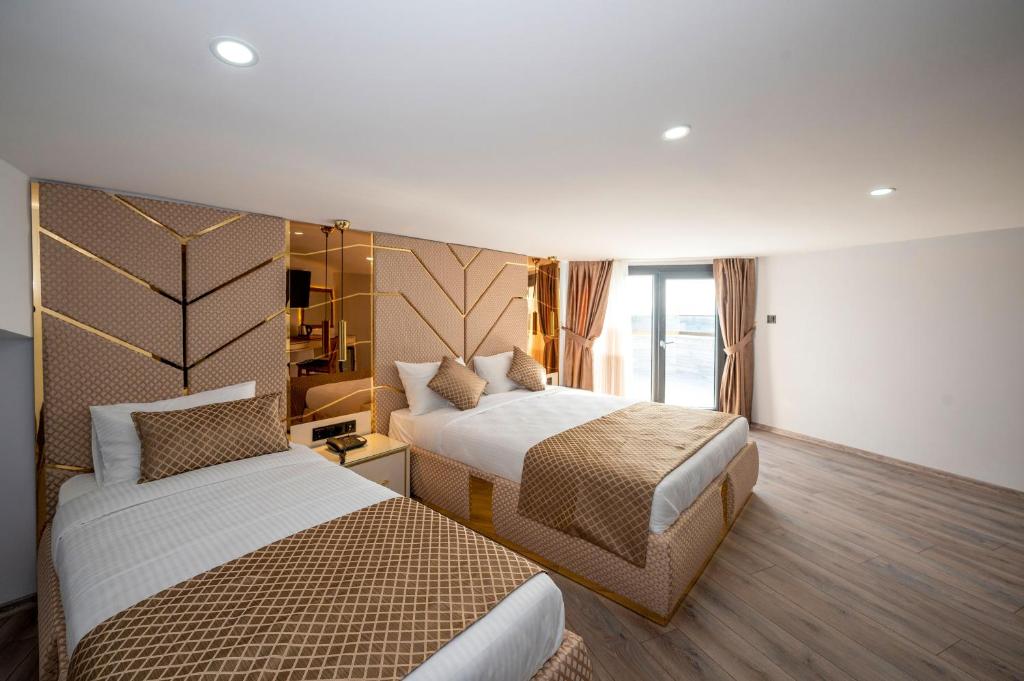 Cama ou camas em um quarto em Luxury Airport Hotel By Zazzoni-İstanbul Airport
