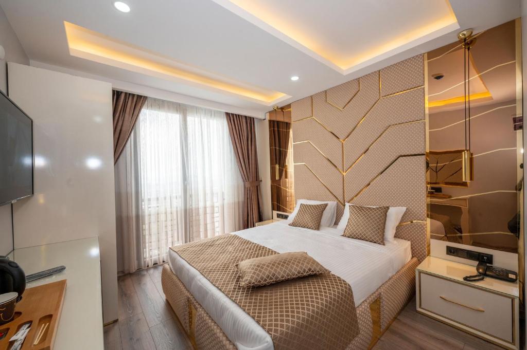 Cama ou camas em um quarto em Luxury Airport Hotel By Zazzoni-İstanbul Airport