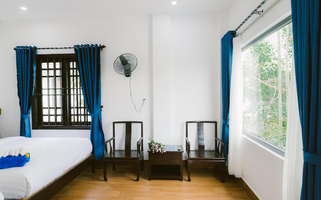 Postel nebo postele na pokoji v ubytování Hoi An Nguyen Homestay