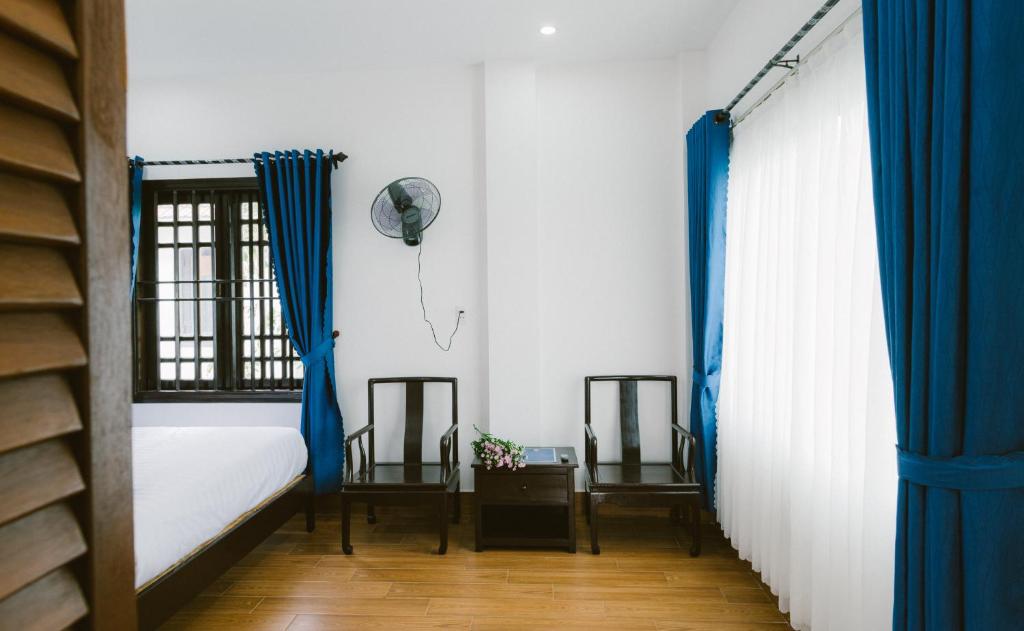 Postel nebo postele na pokoji v ubytování Hoi An Nguyen Homestay