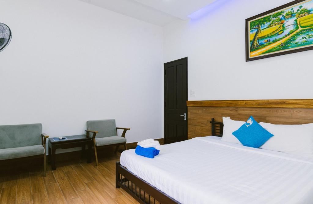 Postel nebo postele na pokoji v ubytování Hoi An Nguyen Homestay