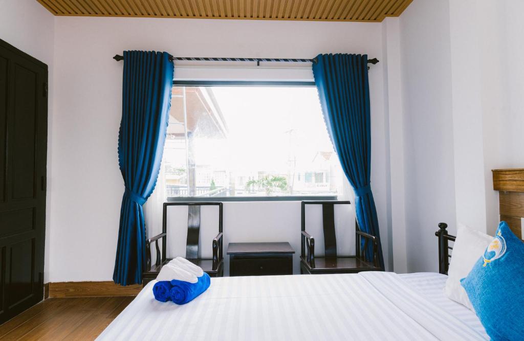 Postel nebo postele na pokoji v ubytování Hoi An Nguyen Homestay