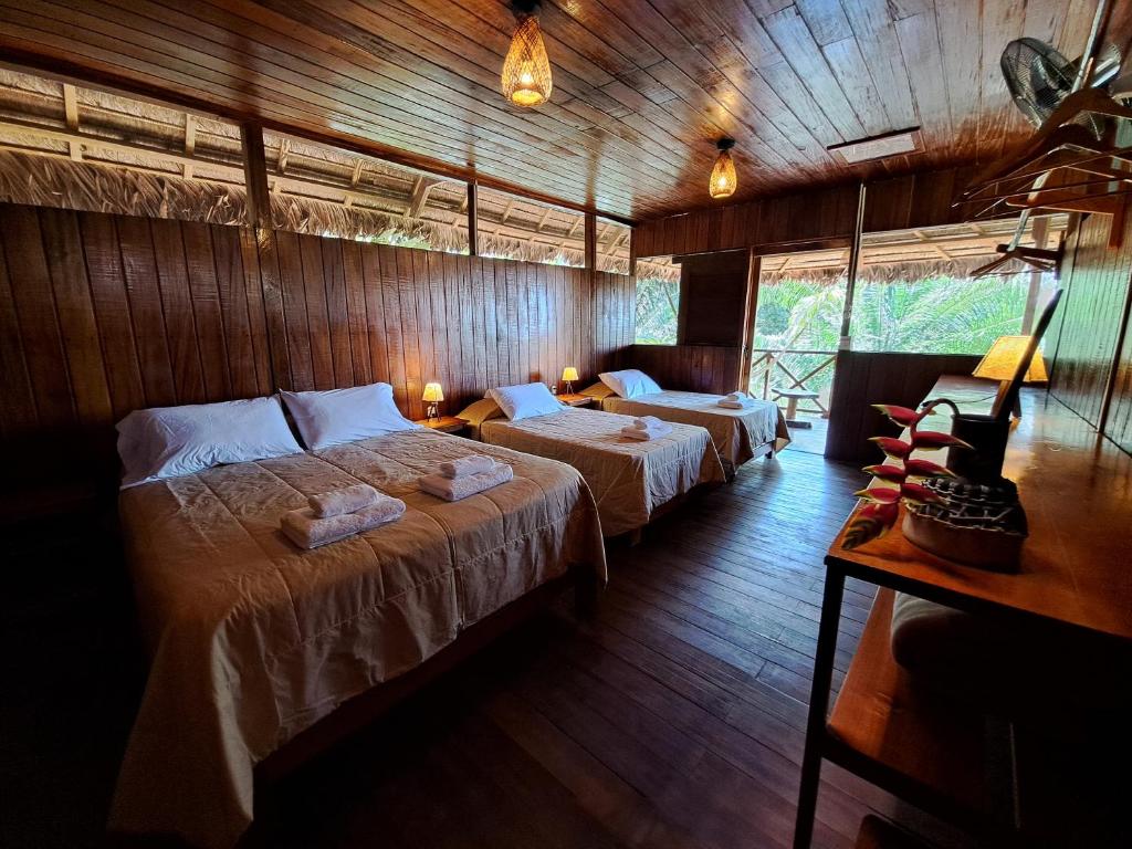 Postel nebo postele na pokoji v ubytování Andean Wings Sotupa Eco Lodge